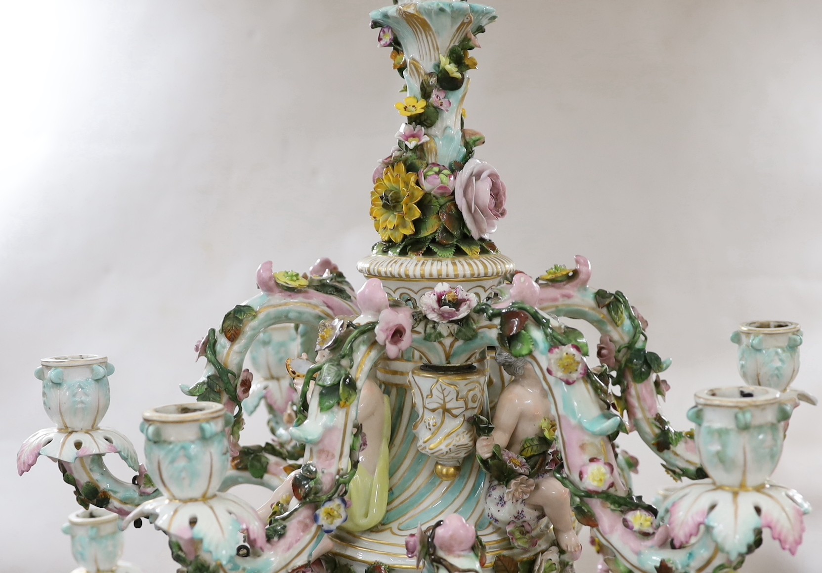 A 19th century continental floral encrusted porcelain nine branch chandelier, 77cm drop